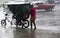 Rickshaw under a rainfall in Havana.
