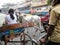 Rickshaws and bullock carts slow the traffic