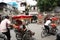 Rickshaws drive tourists in a street of Hanoi