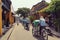 Rickshaws traveling along Hanoi street