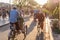 Rickshaws and Vietnamese woman in traditional hat on bicycle