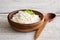 Ricotta cheese, curd cheese, farmers cheese or tvorog in wooden bowl