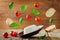 Ricotta cheese with flying bread slices, tomatoes and Basil on a