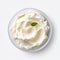 ricotta cheese in a white saucer with a mint leaf