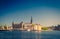 Riddarholmen island district with Riddarholm Church spires and typical sweden colorful gothic buildings, boat ship moored on Lake