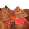 Ridding saddle on a brown horse taken closeup.