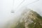 Ride on the cable car through the clouds in the mountain resort, krasnaya polyana, sochi, russia