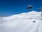 Ride in the chairlift over white slopes in the deserted ski area