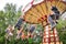 Ride Swing Carousel in motion in amusement park