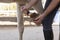 A rider cleaning his horse`s hooves