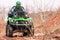 Rider driving in the quadbike race in winter in the forest