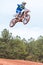 Rider Gets Airborne Going Over Jump In Motocross Race