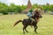 Rider on horse with spear at Pasola Festival, Kodi, Sumba Island, Nusa Tenggara