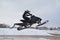 Rider on the snowmobile jumping