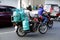 RIder use motorcycle to deliver multiple tanks of LPG or liquified petroleum gas to a customer