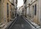 Rider on white horse in the old town of Arles in Provence. France.