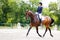 Rider woman on her course in dressage competition