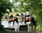 Riders Crossing a River