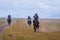 Riders galloping in rain, Kyrgyzstan