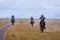 Riders galloping in rain, Kyrgyzstan