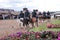 Riders on horseback show success to the public . Demonstrations