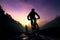 Riders on mountain bikes explore rugged terrain during the evening