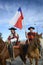 Riders with typical costume and Chilean flag