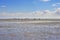 Riders in wadden sea at low tide