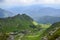 Ridge with grassy slopes and cliffs. Mountains of Marmarosy ridge in a far distance, Carpathian, Ukraine