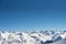 Ridgeline in winter sunny day. Elbrus West Peak view. Dombay ski resort, Western Caucasus, Russia. Wallpaper background