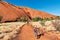 Riding a bicycle around Uluru Ayers Rock. Northern Territory. Australia