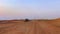 Riding buggies in the desert during sunset