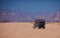 Riding a buggy car through the desert. thrill tourism adventures