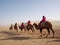 Riding a Camel in A Part of Silk Road in Dunhuang Desert. Travel