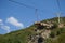 Riding the Chair Lift through the Forest of `The Old Mountan` on Balkan peninsula. Trees on the Hills surrounding in the Mountains