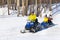 Riding an inflatable banana in the snow on a clear spring day. City of Cheboksary, Russia, 03/10/2019