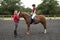 Riding lesson with the rider and instructor