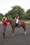 Riding lesson with the rider and instructor