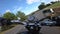 Riding an old black motorbike on a curly asphalt tarmac road