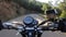 Riding an old black motorbike on a curly asphalt tarmac road driver point of view time lapse