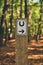 Riding path sign in the woods