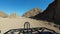 Riding a Quad in the Desert of Egypt. First-person view. Rides ATV bike.