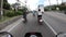 Riding a red rental bike on the roads of Phuket