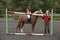 Riding school pupil and instructor