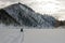 Riding a snowmobile on a frozen river.