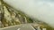 Riding on Sustenpass in Switzerland in the hard fog