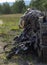 Rifles, camouflage backpack and uniform, ammunition, radio, box on military range, army weapon of active game airsoft
