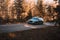 Riga, Latvia 21 October 2021: Front view of Audi A6 3.0 TDI Quattro in the sunny autumn forest, auto in fast motion with a blurred