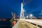 Riga Latvia. Close View Of Deserted Vansu Cable-Stayed Bridge In Bright Night Illumination Over The Daugava River