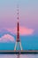 Riga, Latvia. Famous Landmark Television Tower In Pink Purple Sunset